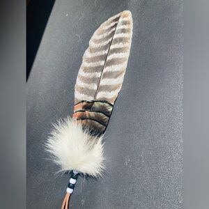 Native American Indian smudging and prayer feather. Or rearview mirror